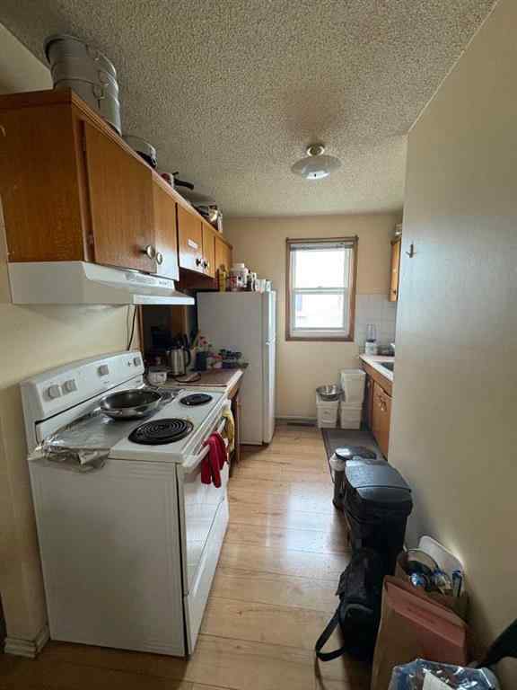 MLS® A2256420 - Unit #1-6 1608 38 Street SW in Rosscarrock Calgary, Multi-Family