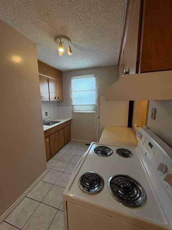 MLS® A2256420 - Unit #1-6 1608 38 Street SW in Rosscarrock Calgary, Multi-Family