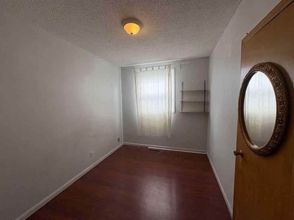MLS® A2256420 - Unit #1-6 1608 38 Street SW in Rosscarrock Calgary, Multi-Family