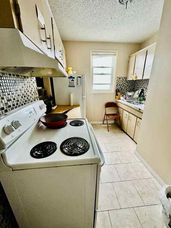 MLS® A2256420 - Unit #1-6 1608 38 Street SW in Rosscarrock Calgary, Multi-Family