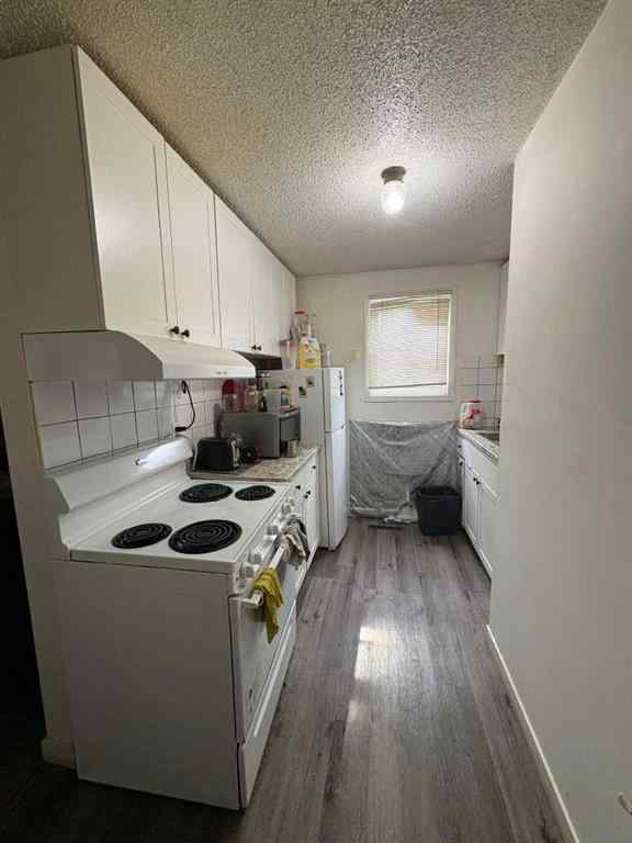 MLS® A2256420 - Unit #1-6 1608 38 Street SW in Rosscarrock Calgary, Multi-Family