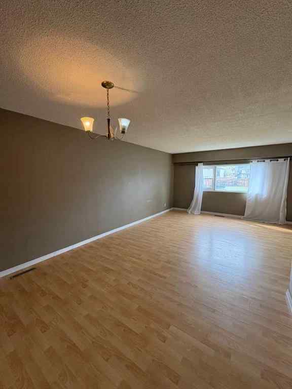 MLS® A2256420 - Unit #1-6 1608 38 Street SW in Rosscarrock Calgary, Multi-Family
