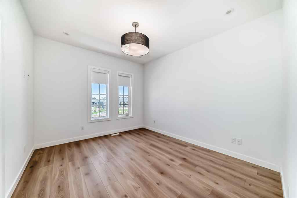 MLS® A2256548 - Unit #512 8155 8 Avenue SW in West Springs Calgary, Residential