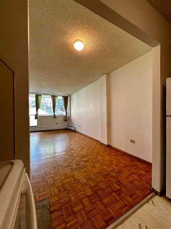 MLS® A2256624 - Unit #109 1616 8 Avenue NW in Hounsfield Heights/Briar Hill Calgary, Residential