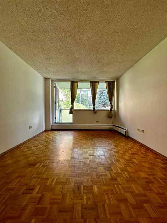 MLS® A2256624 - Unit #109 1616 8 Avenue NW in Hounsfield Heights/Briar Hill Calgary, Residential