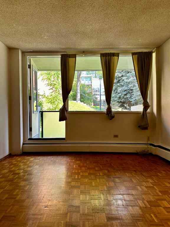 MLS® A2256624 - Unit #109 1616 8 Avenue NW in Hounsfield Heights/Briar Hill Calgary, Residential