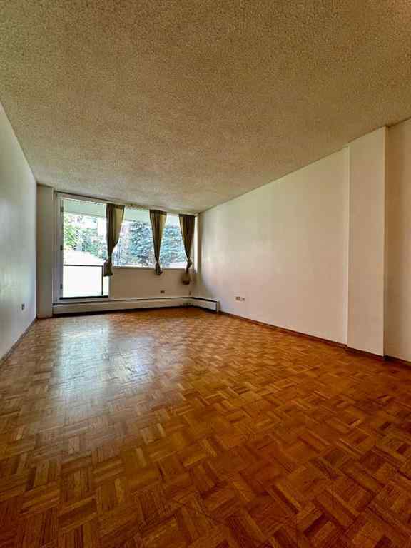 MLS® A2256624 - Unit #109 1616 8 Avenue NW in Hounsfield Heights/Briar Hill Calgary, Residential