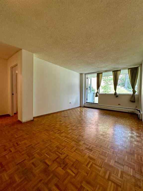 MLS® A2256624 - Unit #109 1616 8 Avenue NW in Hounsfield Heights/Briar Hill Calgary, Residential