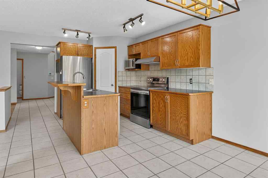 MLS® A2256959 - 47 Mt Apex Crescent SE in McKenzie Lake Calgary, Residential