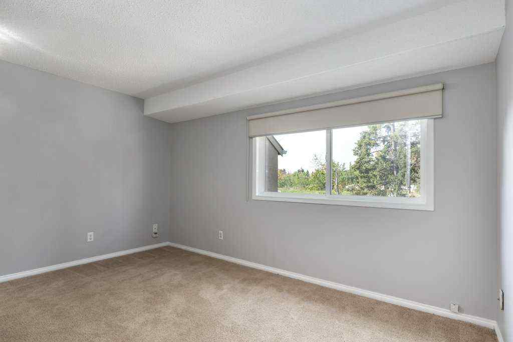 MLS® A2257022 - Unit #104 829 Coach Bluff Crescent SW in Coach Hill Calgary, Residential