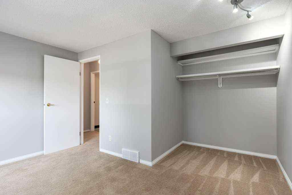 MLS® A2257022 - Unit #104 829 Coach Bluff Crescent SW in Coach Hill Calgary, Residential