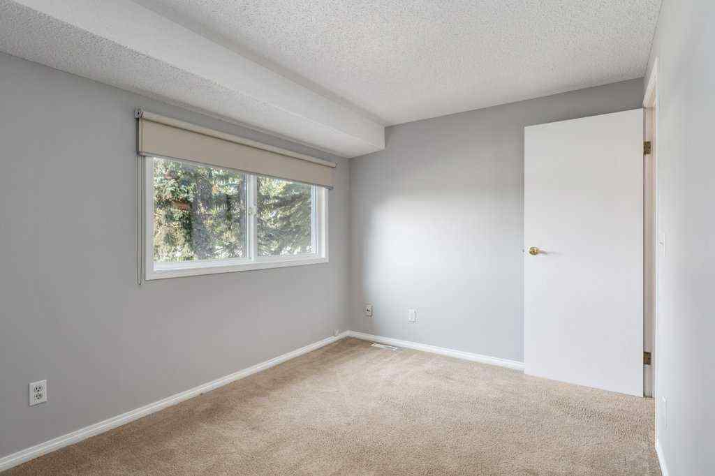MLS® A2257022 - Unit #104 829 Coach Bluff Crescent SW in Coach Hill Calgary, Residential