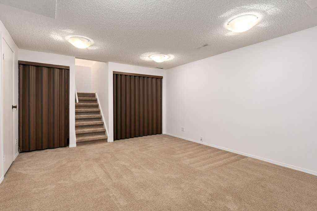 MLS® A2257022 - Unit #104 829 Coach Bluff Crescent SW in Coach Hill Calgary, Residential