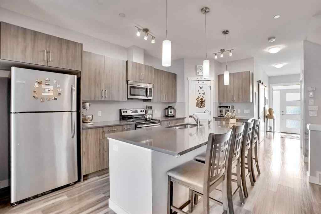 MLS® A2257082 - 64 Howse Drive NE in Livingston Calgary, Residential