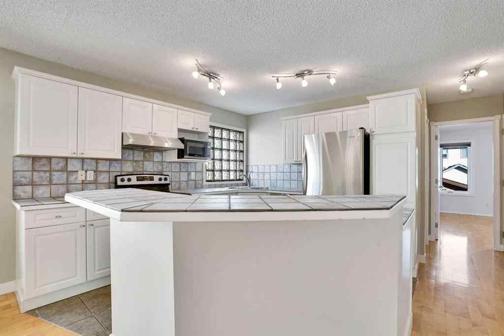 MLS® A2257219 - 307 Arbour Grove Close NW in Arbour Lake Calgary, Residential