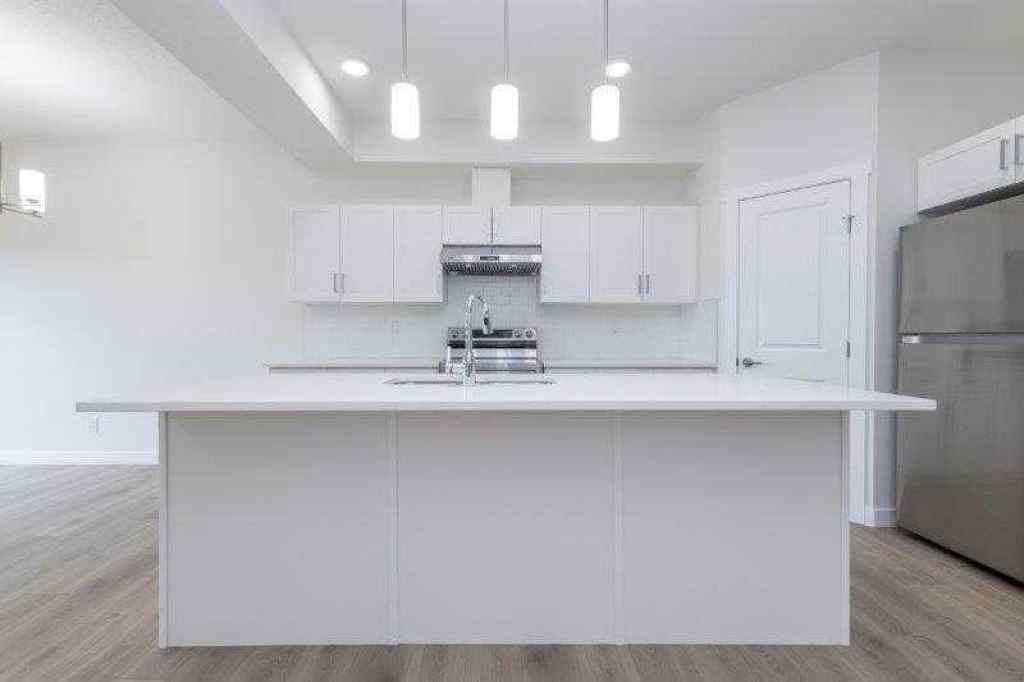 MLS® A2257233 - 33 Walcrest Lane SE in Walden Calgary, Residential
