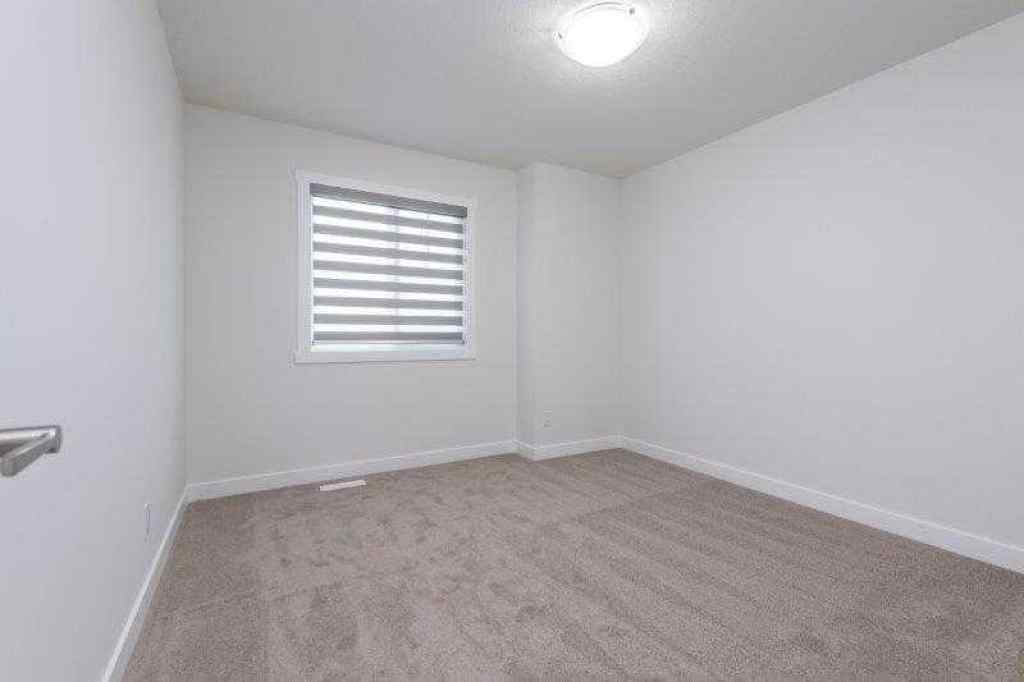 MLS® A2257233 - 33 Walcrest Lane SE in Walden Calgary, Residential