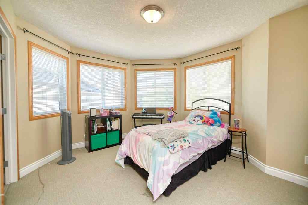 MLS® A2257338 - 24 Cougar Ridge Mews SW in Cougar Ridge Calgary, Residential