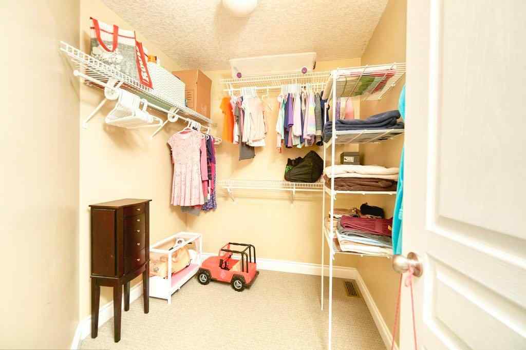 MLS® A2257338 - 24 Cougar Ridge Mews SW in Cougar Ridge Calgary, Residential