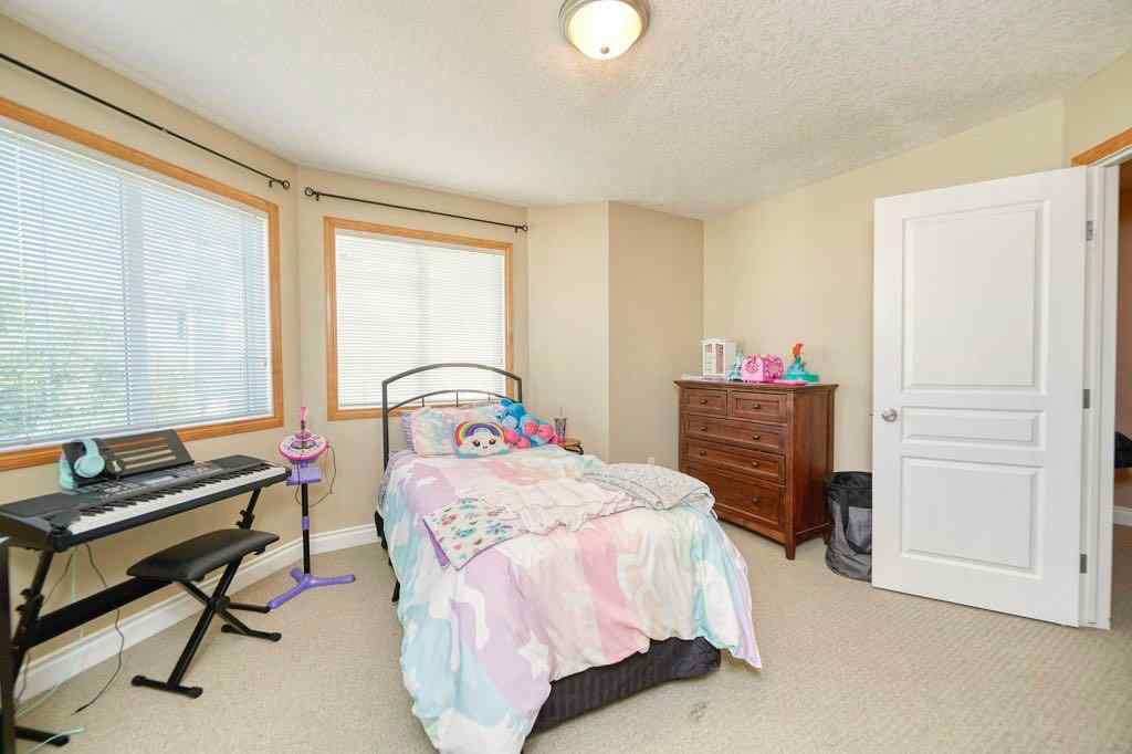MLS® A2257338 - 24 Cougar Ridge Mews SW in Cougar Ridge Calgary, Residential