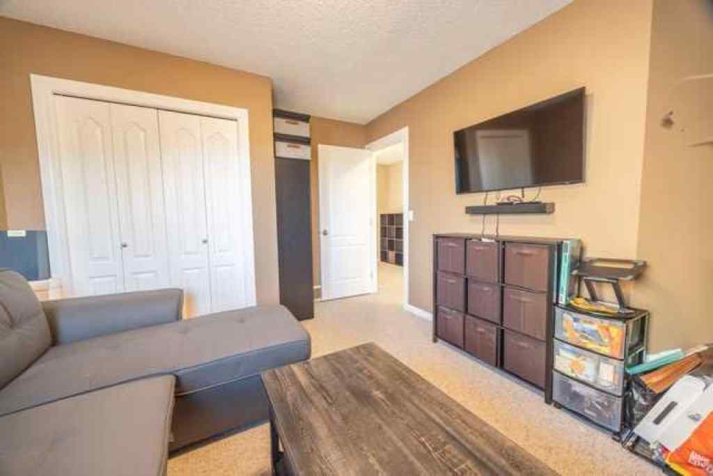 MLS® A2257342 - 28 Crestmont Way SW in Crestmont Calgary, Residential