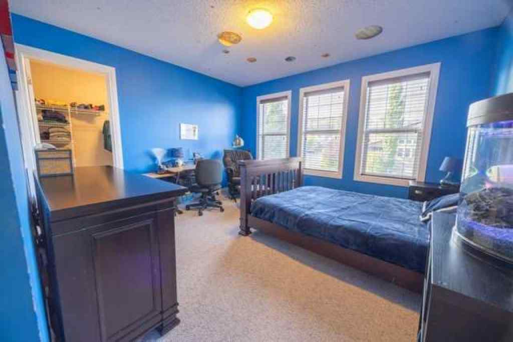 MLS® A2257342 - 28 Crestmont Way SW in Crestmont Calgary, Residential