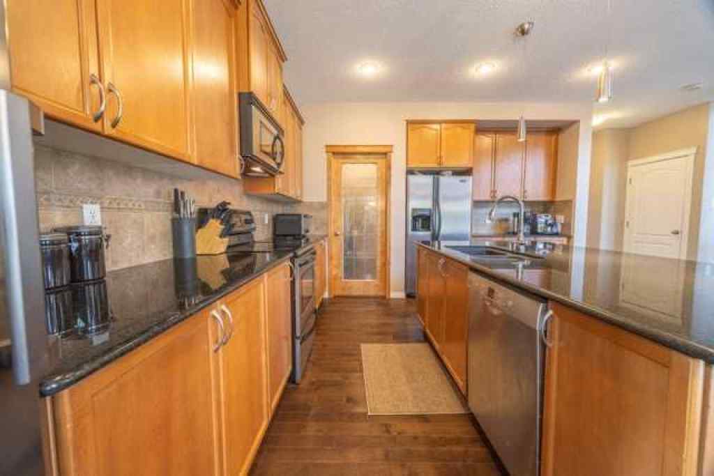 MLS® A2257342 - 28 Crestmont Way SW in Crestmont Calgary, Residential