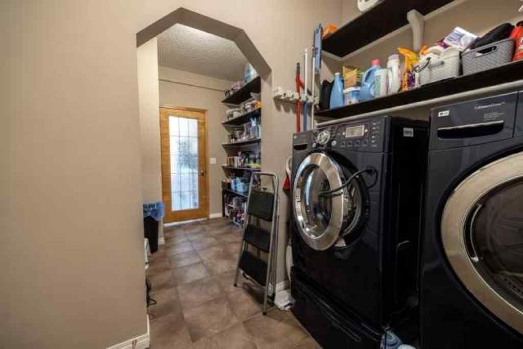 MLS® A2257342 - 28 Crestmont Way SW in Crestmont Calgary, Residential