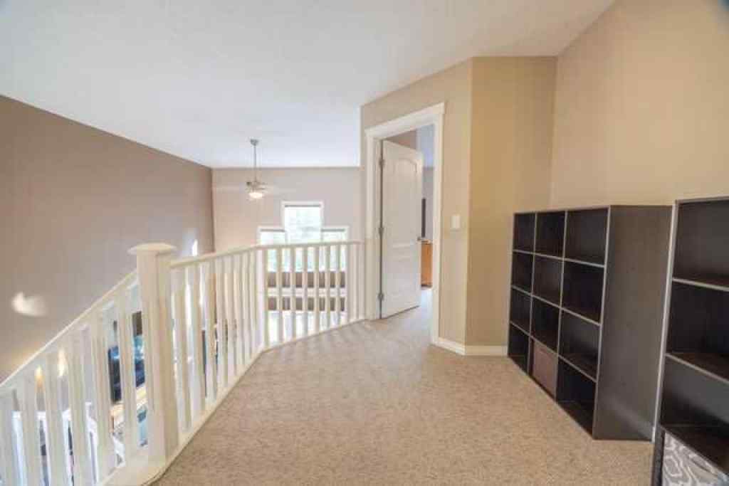 MLS® A2257342 - 28 Crestmont Way SW in Crestmont Calgary, Residential