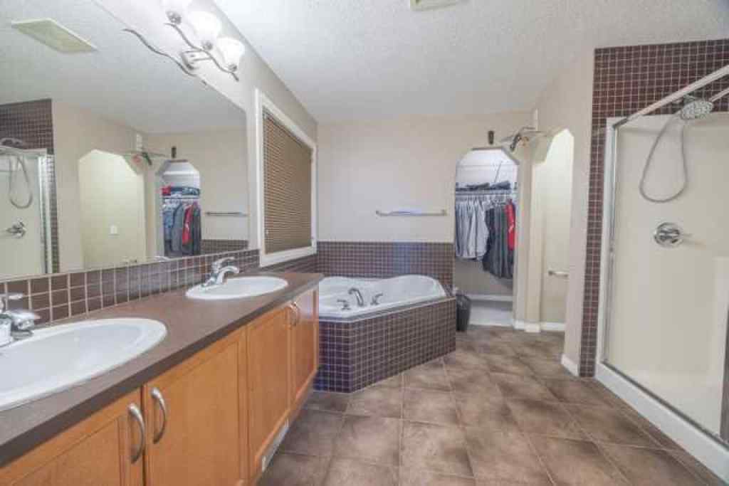 MLS® A2257342 - 28 Crestmont Way SW in Crestmont Calgary, Residential