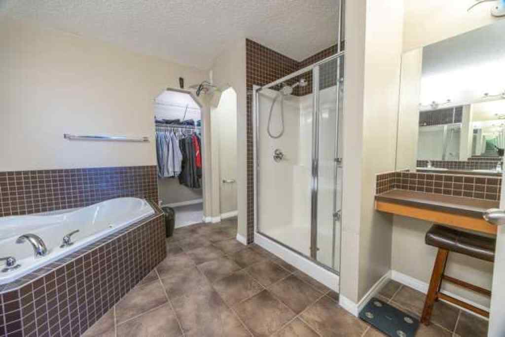 MLS® A2257342 - 28 Crestmont Way SW in Crestmont Calgary, Residential
