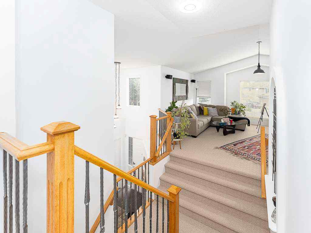 MLS® A2257360 - 208 Mt Brewster Circle SE in McKenzie Lake Calgary, Residential