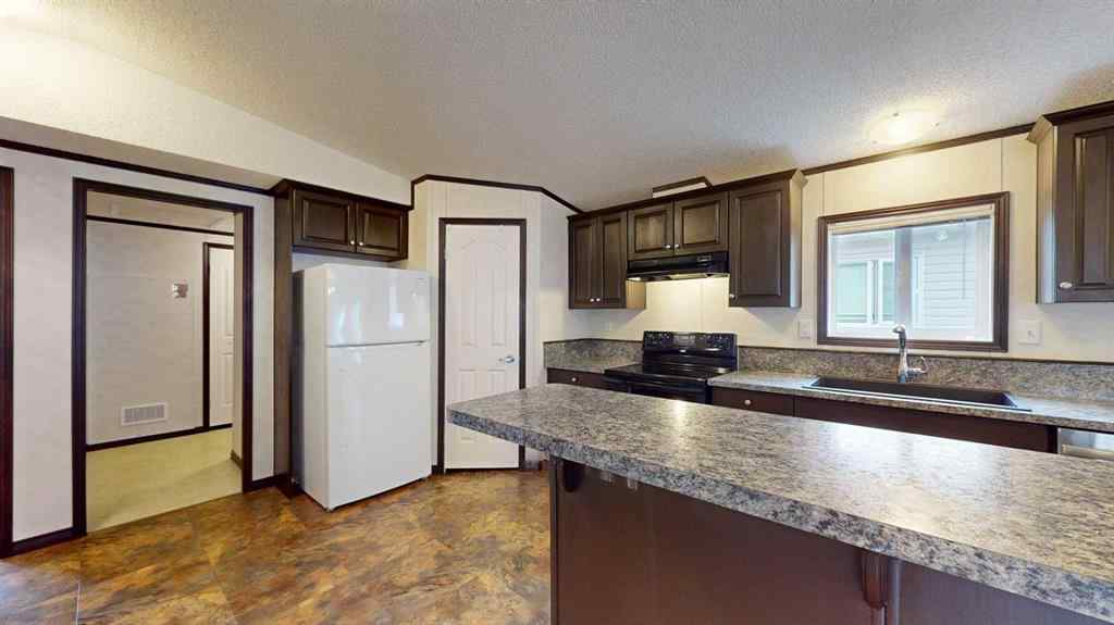MLS® A2257379 - 392 Gregoire Crescent  in Gregoire Park Fort McMurray, Residential