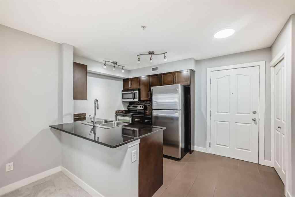 MLS® A2257393 - Unit #107 7110 80 Avenue NE in Saddle Ridge Calgary, Residential