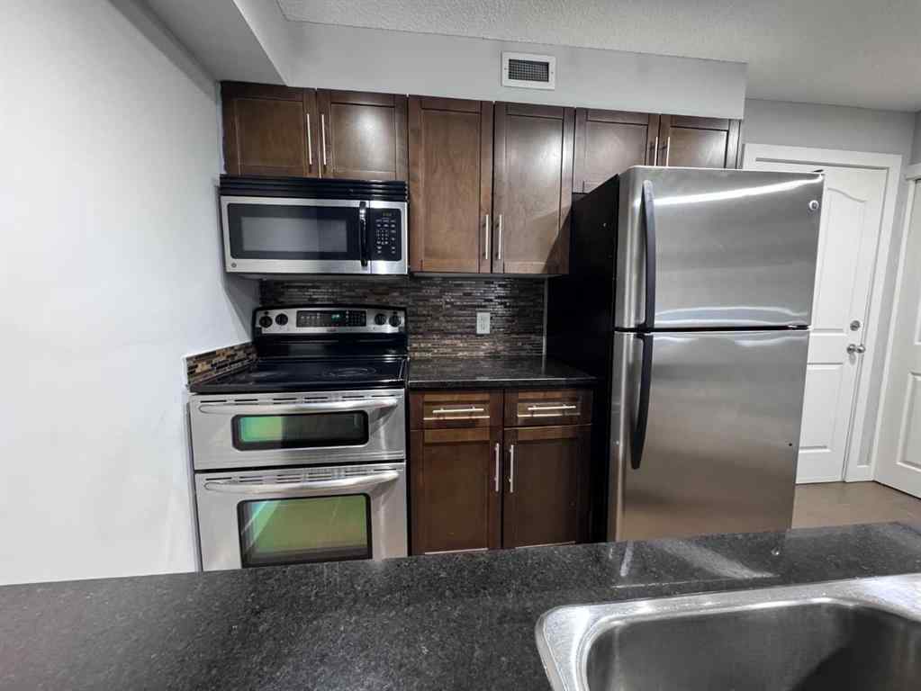 MLS® A2257393 - Unit #107 7110 80 Avenue NE in Saddle Ridge Calgary, Residential