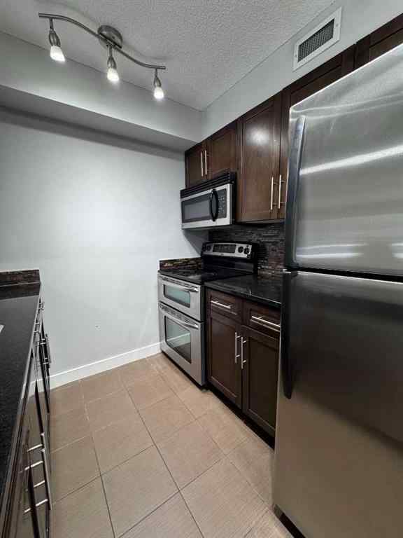 MLS® A2257393 - Unit #107 7110 80 Avenue NE in Saddle Ridge Calgary, Residential