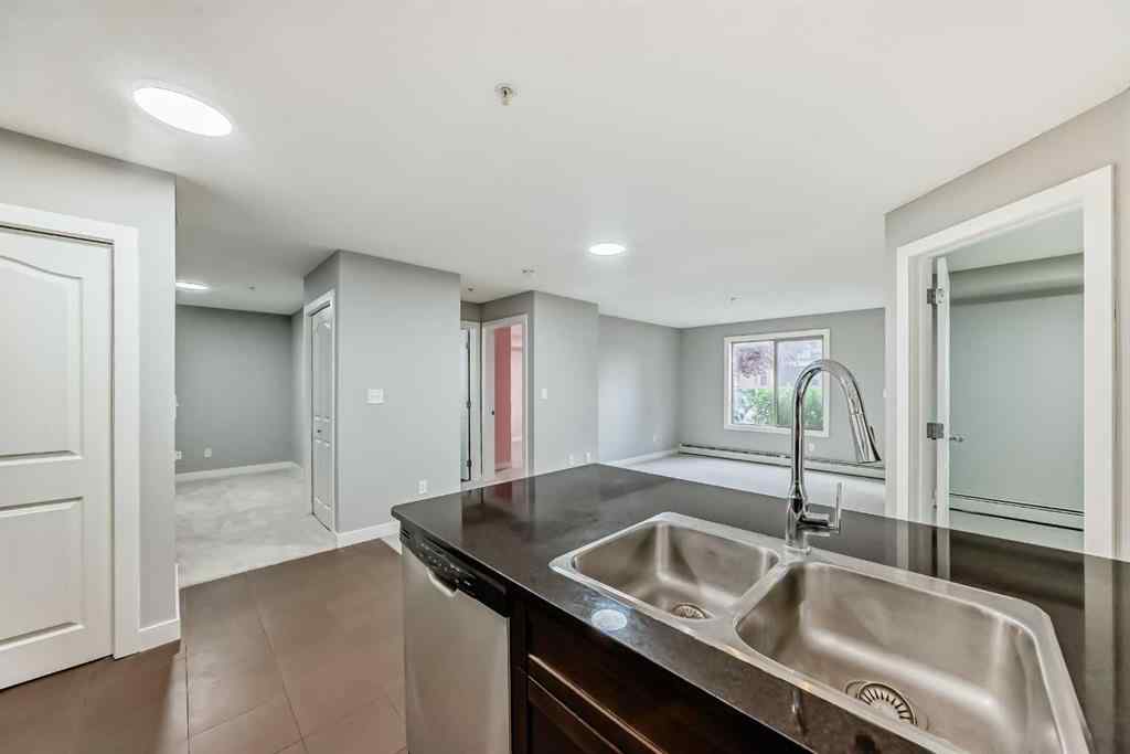 MLS® A2257393 - Unit #107 7110 80 Avenue NE in Saddle Ridge Calgary, Residential