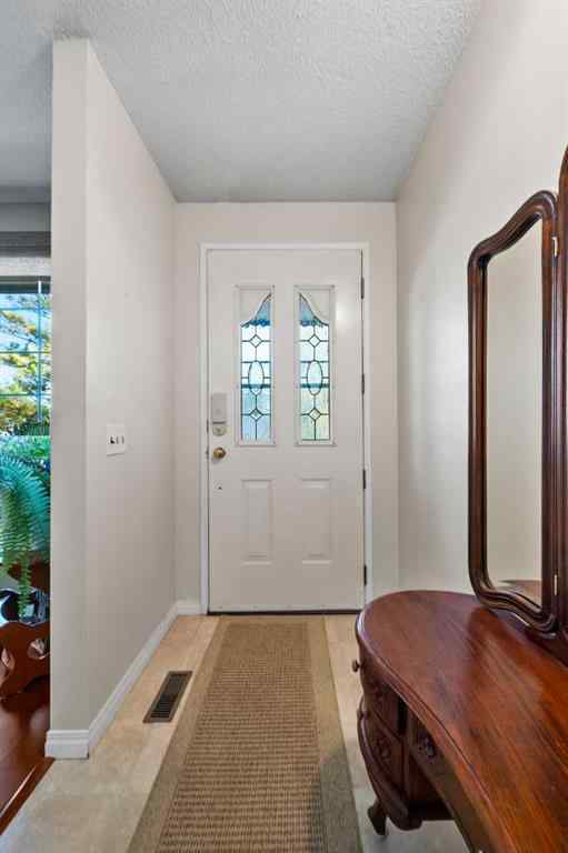 MLS® A2257439 - 12031 Candiac Road SW in Canyon Meadows Calgary, Residential