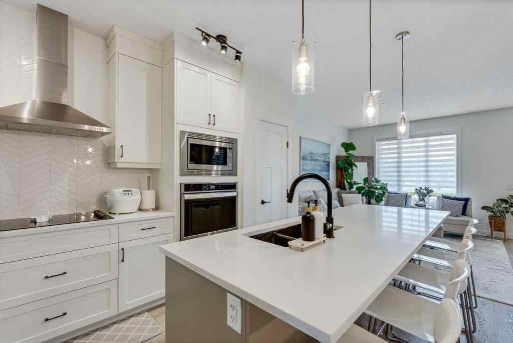 MLS® A2257503 - 145 Lucas Crescent NW in Livingston Calgary, Residential