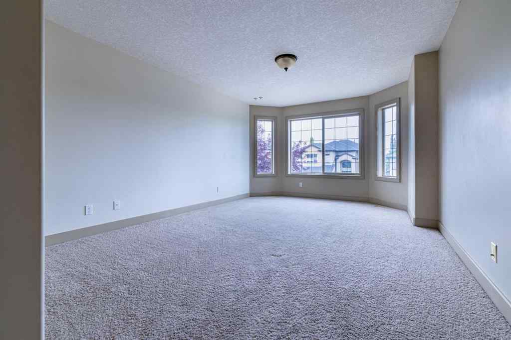 MLS® A2257526 - 52 Elmont Green SW in Springbank Hill Calgary, Residential