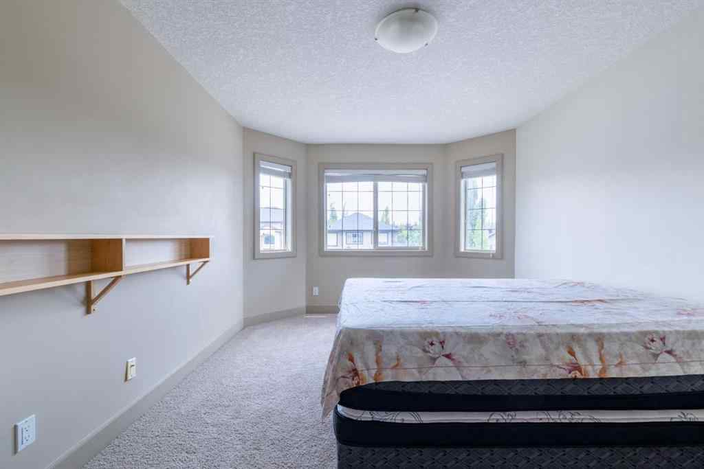 MLS® A2257526 - 52 Elmont Green SW in Springbank Hill Calgary, Residential