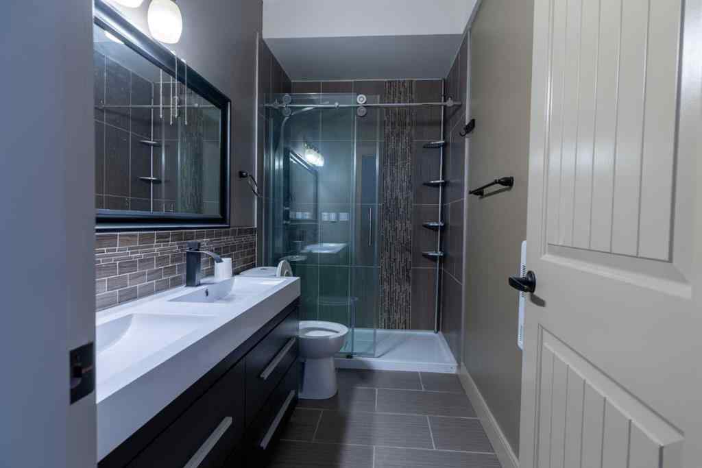 MLS® A2257526 - 52 Elmont Green SW in Springbank Hill Calgary, Residential
