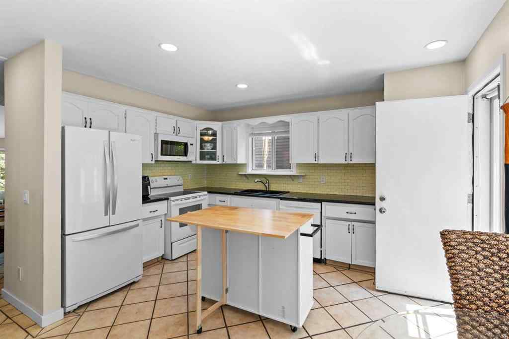 MLS® A2257552 - 131 Stratton Crescent SW in Strathcona Park Calgary, Residential