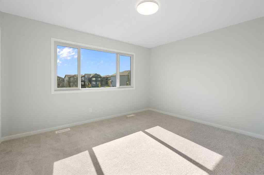 MLS® A2257737 - 34 Herron Common NE in Livingston Calgary, Residential