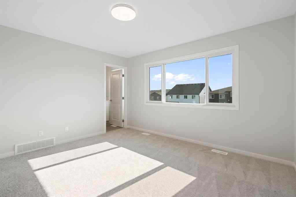 MLS® A2257737 - 34 Herron Common NE in Livingston Calgary, Residential