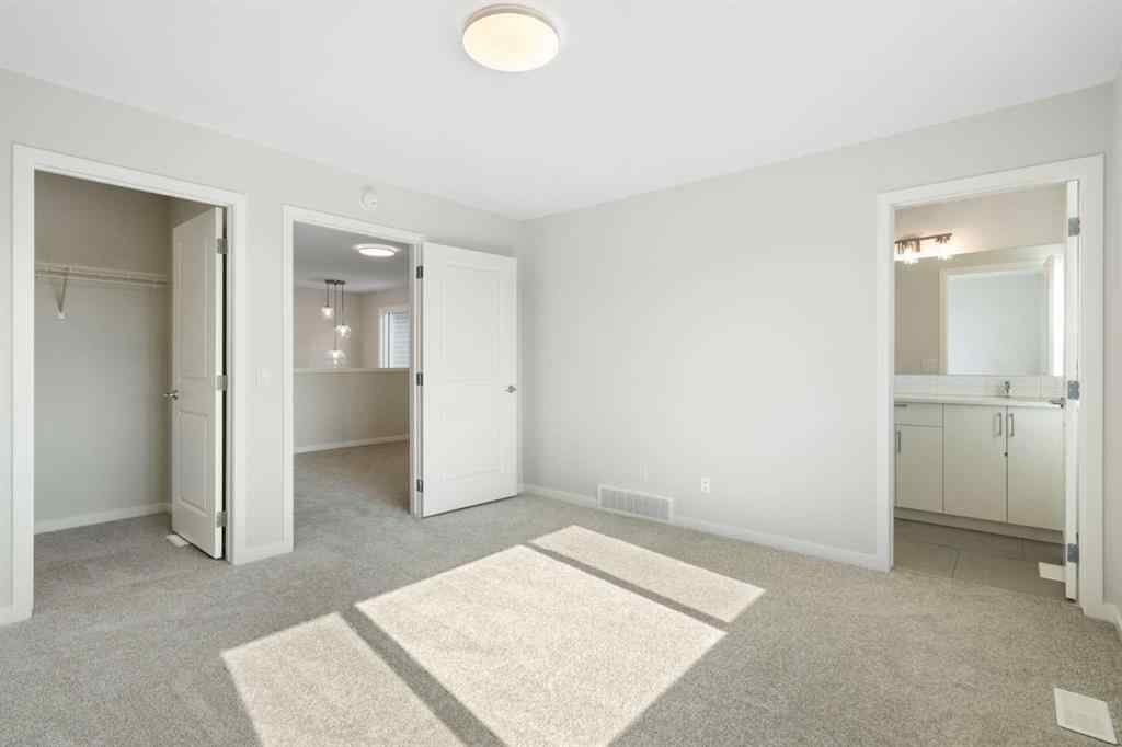MLS® A2257737 - 34 Herron Common NE in Livingston Calgary, Residential