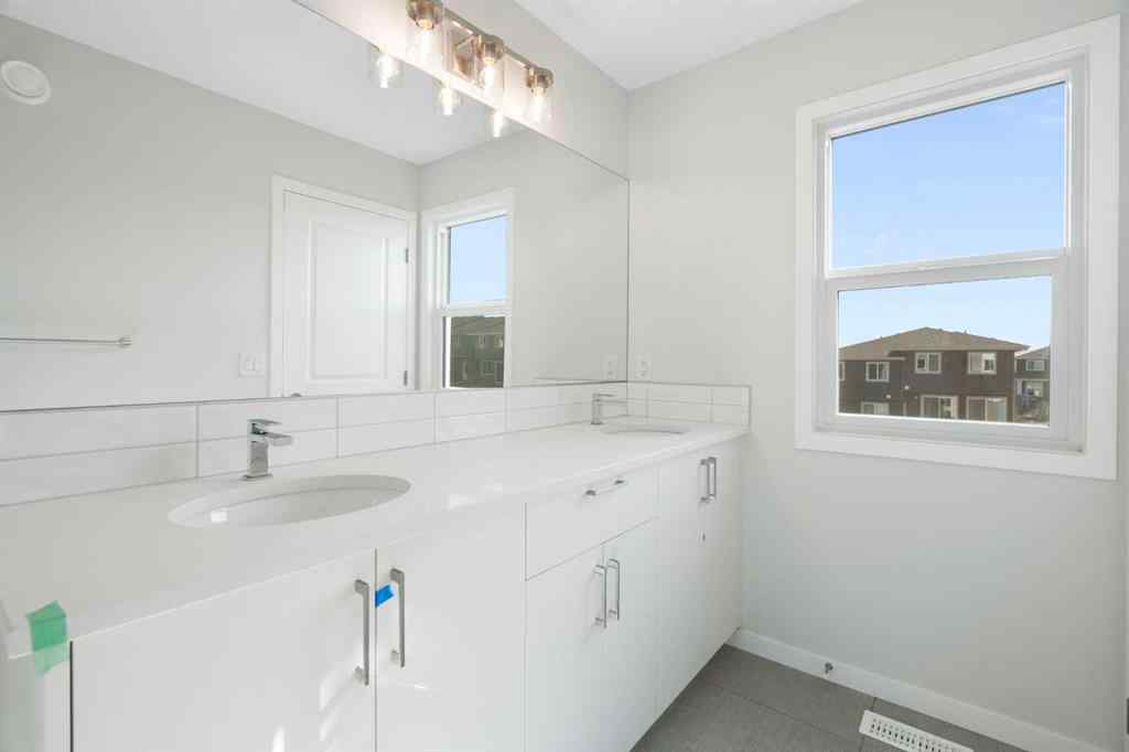 MLS® A2257737 - 34 Herron Common NE in Livingston Calgary, Residential