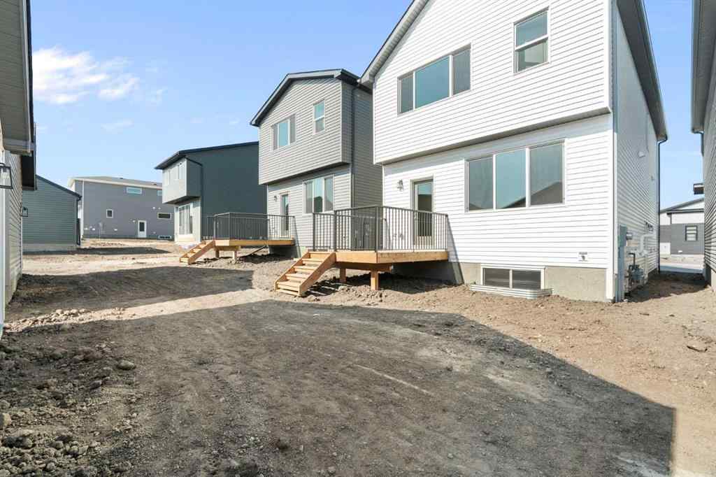 MLS® A2257737 - 34 Herron Common NE in Livingston Calgary, Residential