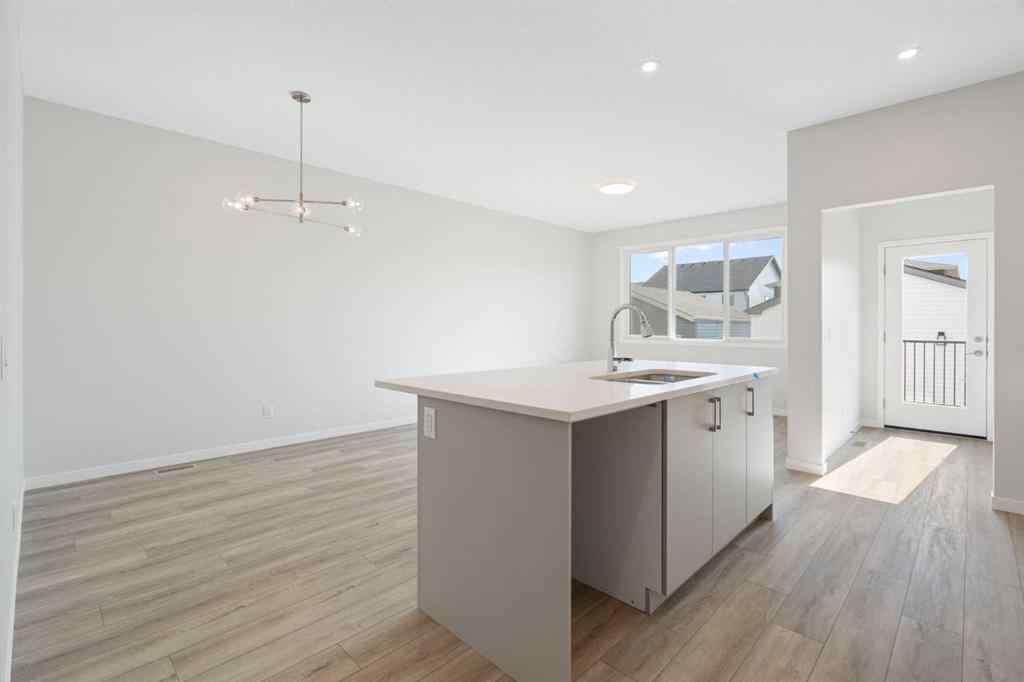 MLS® A2257737 - 34 Herron Common NE in Livingston Calgary, Residential