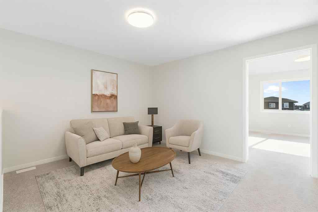 MLS® A2257737 - 34 Herron Common NE in Livingston Calgary, Residential